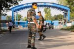 Security personnel patrol after two low intensity explosions reported in the technical area of Jammu Air Force Station in the early hours of Sunday. (PTI)