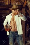 35751547-sexy-cowboy-macho-man-drink-whiskey-in-barn.jpg