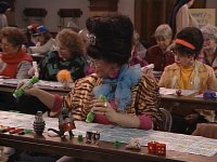 roseanne table full of bingo cards.jpeg