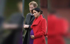 Meghan-Markle-Baby-Bump-Purple-Dress-Red-Coat0A0AMeghan-Markle-Baby-Bump-Purple-Dress-Red-Coa...webp